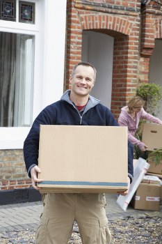 Movers loading boxes and furniture in a Tufnell Park residential street