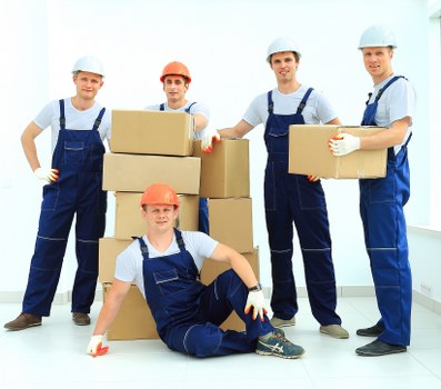 Packed moving boxes and furniture prepared for local home removals