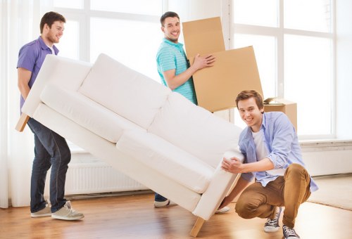 Removal team loading household furniture for a flat move in Tufnell Park