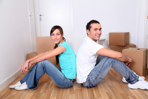 Moving crew loading furniture into a removal vehicle