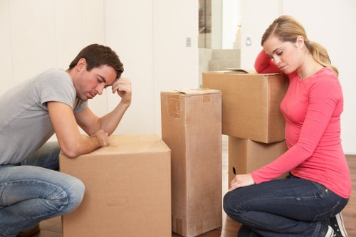 Packed office equipment and furniture ready for transport in North London